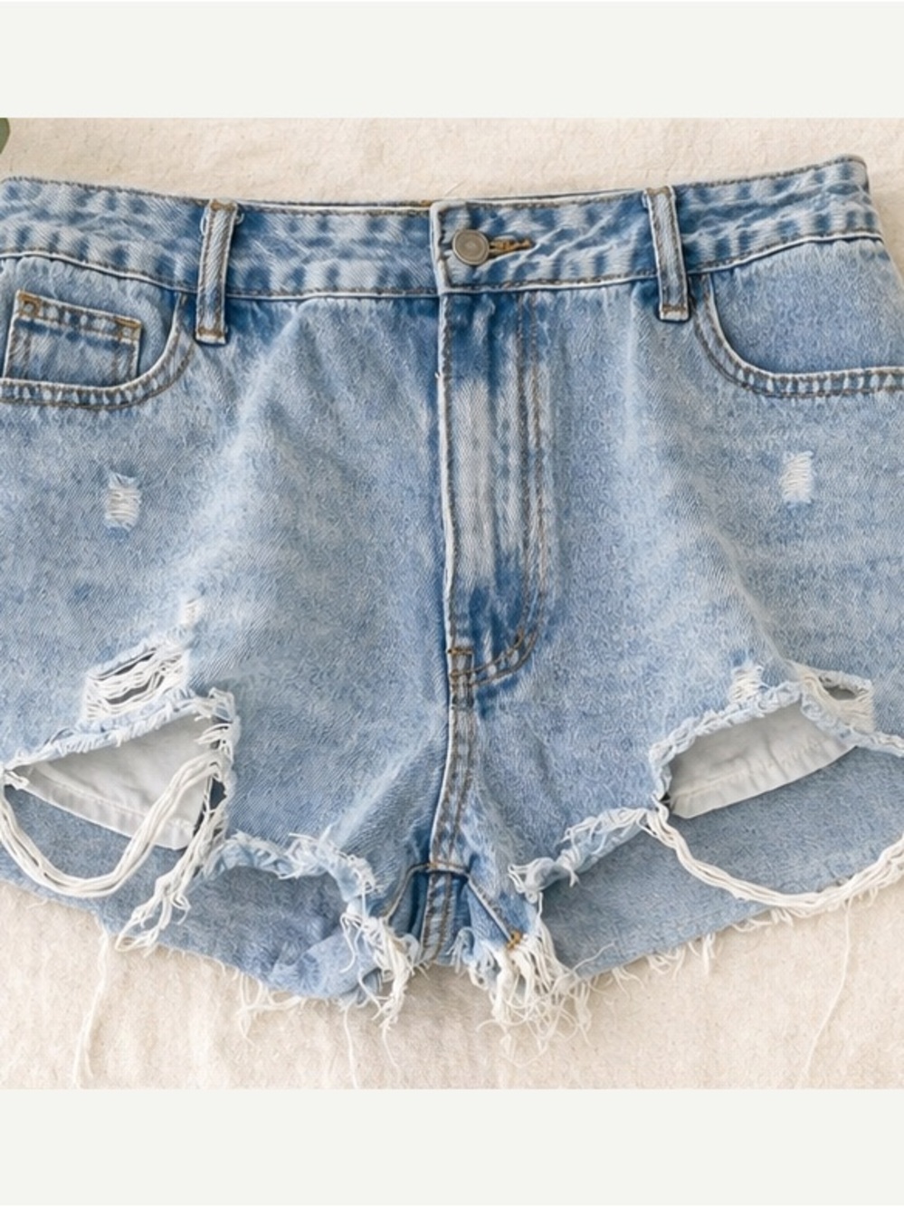High-Rise Light Blue Distressed Denim Shorts
